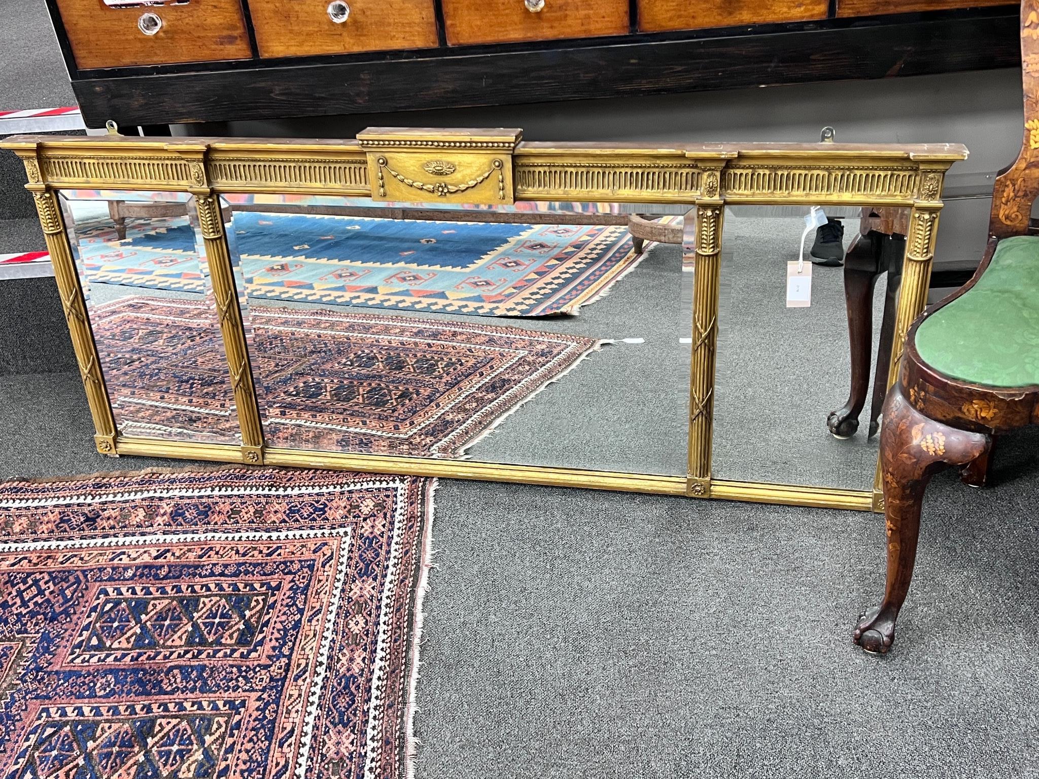 A Regency style gilt and composition overmantel mirror, width 152cm, height 61cm
